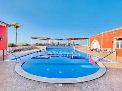 a large swimming pool with blue water at NEW Villa 66 - Palheiro Village by YMR in São Gonçalo