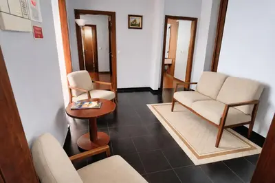 a waiting room with two chairs and a table at Golden Sun Refugio in Estreito da Calheta