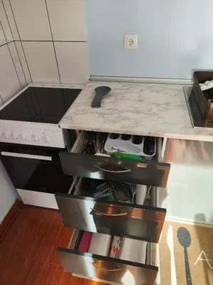 a kitchen with a sink and a shelf with dishes at Golden Sun Refugio in Estreito da Calheta