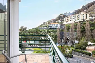 a view from a balcony of a street with cars at Anavrin by Escape to Madeira in Ponta do Sol