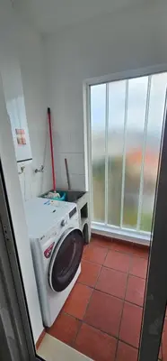 a washing machine in a room with a window at Atlantic Breeze - Free Parking in Funchal