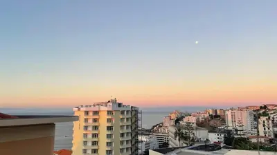 a view of a city with the ocean and buildings at Atlantic Breeze - Free Parking in Funchal