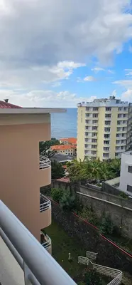 a view of the ocean from a balcony of a building at Atlantic Breeze - Free Parking in Funchal