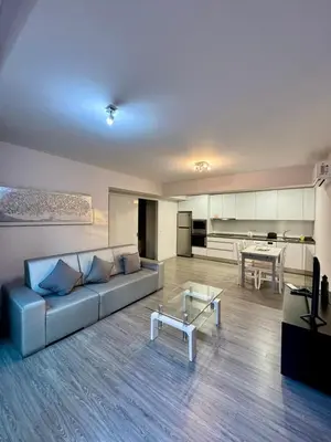 a living room with a couch and a table at Alameda Formosa Madeira in Funchal