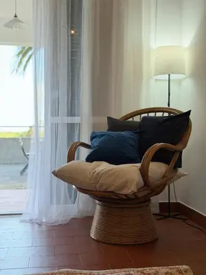 a living room with a couch and a window at Casa do Profeta in Porto Santo