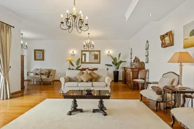 a living room with a couch and a table at Villa Lucente by Homie in Santa Maria Maior