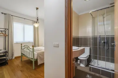 a bathroom with a shower and a sink and a toilet at Villa Lucente by Homie in Santa Maria Maior