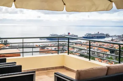 a balcony with a view of a harbor at Villa Lucente by Homie in Santa Maria Maior