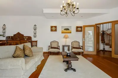 a living room with a couch and a table at Villa Lucente by Homie in Santa Maria Maior