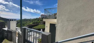 a balcony of a building with a view of the ocean at Casa Vereda do Calhau - With barbecue in Campanário