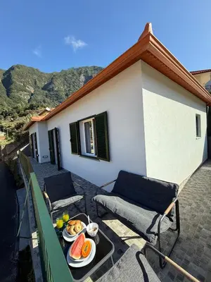 a tray of food on a table on a patio at Casa Refúgio M in São Vicente
