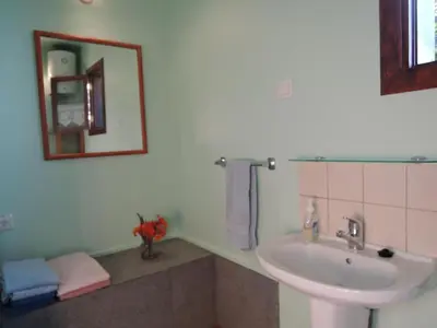 a bathroom with a sink and a mirror at Holiday Home in Canhas mit Schönem Garten by Interhome in Ponta do Sol