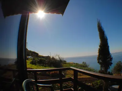 a view of the ocean from a balcony at Holiday Home in Canhas mit Schönem Garten by Interhome in Ponta do Sol