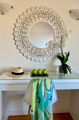 a table with a mirror and some green limes at Holiday Home Ideales Familienhaus mit freiem Stadt- und Meerblick by Interhome in Funchal