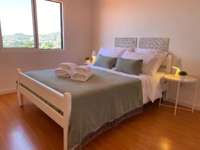 a bedroom with a bed with two towels on it at Holiday Home Ideales Familienhaus mit freiem Stadt- und Meerblick by Interhome in Funchal