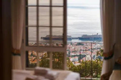 a view of a city from a window at GuestReady - Charming retreat in Funchal in Funchal