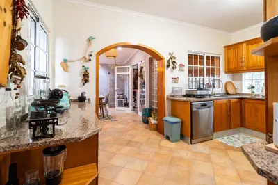 a kitchen with an archway leading to a dining room at GuestReady - Charming retreat in Funchal in Funchal