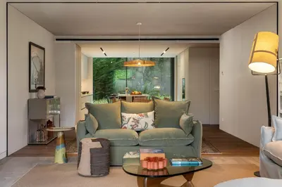 a living room with a couch and a table at Savoy Monumentalis XII Comfort with Pool in Funchal