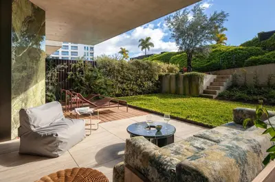 a patio with a couch and a table at Savoy Monumentalis XII Comfort with Pool in Funchal