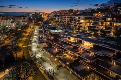 an aerial view of a city at night at Savoy Monumentalis XII Comfort with Pool in Funchal