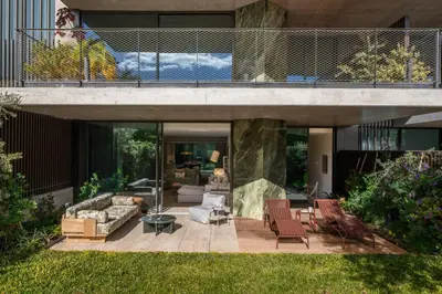 a living area of a house with a patio at Savoy Monumentalis XII Comfort with Pool in Funchal