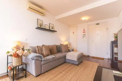 a living room with a couch and a table at Calas Loft by Atlantic Holiday in Funchal