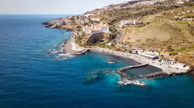 an aerial view of a beach with boats in the water at Sunrising Apartment by Atlantic Holiday in Caniço