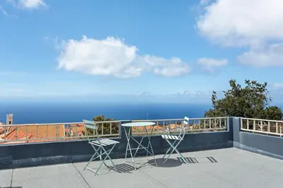 a view of the ocean from a balcony at Casa Pereira in Ponta do Pargo