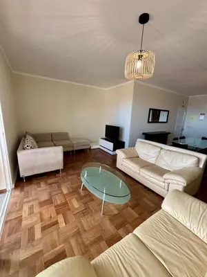 a living room with a couch and a table at Santos Living Rentals in Funchal