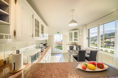 a kitchen with a plate of fruit on a counter at Melody House of Ponta do Sol in Canhas