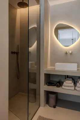 a bathroom with a sink and a mirror at Moradia Exclusiva V3 com Piscina Privada e Vista Mar- Salema in Salema