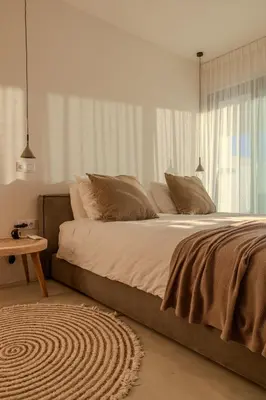 a white house with large windows and a patio at Moradia Exclusiva V3 com Piscina Privada e Vista Mar- Salema in Salema