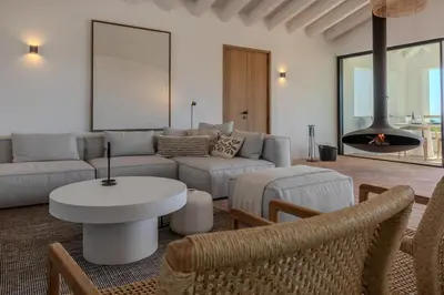 a white house with a courtyard with plants at Exclusive Luxury Villa Pool & Ocean View Salema in Budens