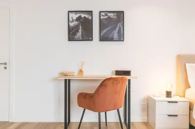 a desk in a bedroom with a chair at Breeze House 2 by AH in Caniço