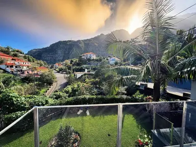 a balcony with a view of a town and a mountain at Bela Vista Studio in Ponta Delgada