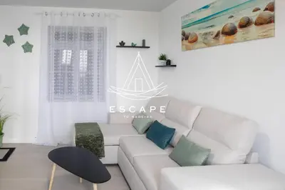 a white living room with a white couch at Casa Aguinha by Escape to Madeira in Arco da Calheta