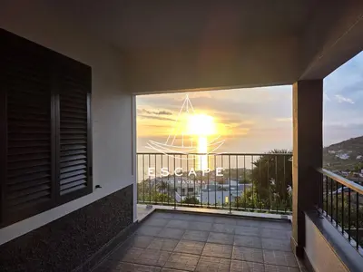 a balcony with a view of the sunset at Casa Aguinha by Escape to Madeira in Arco da Calheta