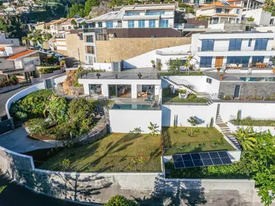 an aerial view of a house with solar panels at Atlantic Bloom by Homie in Santa Maria Maior