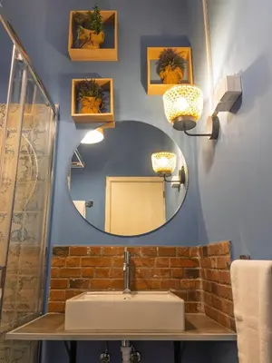 a shower with a shower head in a bathroom at Casa do Avô Diogo , By OP in Funchal