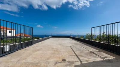 a large patio with a view of the ocean at Casa da Fazenda by LovelyStay in Gaula