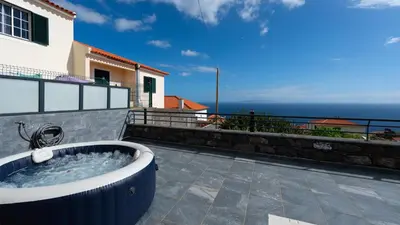 a hot tub on the balcony of a house at Casa da Fazenda by LovelyStay in Gaula