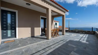 a balcony of a house with a view of the ocean at Casa da Fazenda by LovelyStay in Gaula