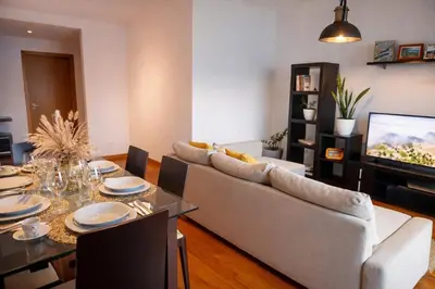 a living room with a couch and a table at Luxury Ocean View Apartment Funchal in Funchal
