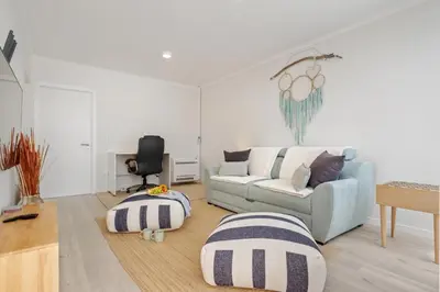 a living room with a couch and a table at Villa Amor do Mar Ocean View, Panoramas, Jacuzzi in Funchal