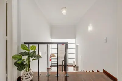 a hallway with a glass table and a potted plant at Villa Amor do Mar Ocean View, Panoramas, Jacuzzi in Funchal
