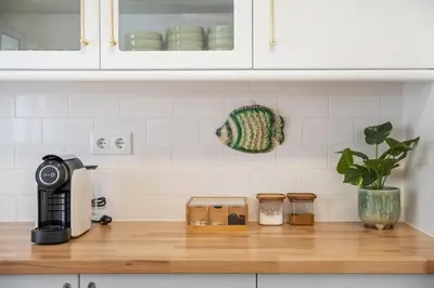 a kitchen counter with a coffee maker on a counter top at Villa Amor do Mar Ocean View, Panoramas, Jacuzzi in Funchal