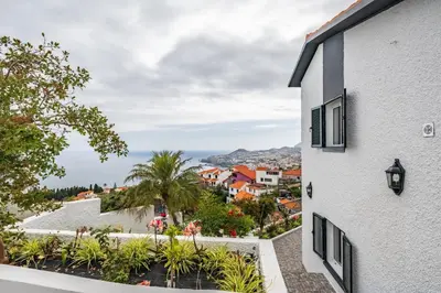a view of a city from a building at Villa Amor do Mar Ocean View, Panoramas, Jacuzzi in Funchal