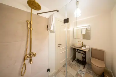 a bedroom with a bed with two white towels on it at Casa da Avolita, by Rent2u, Lda in Arco da Calheta