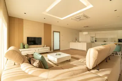 a living room with a couch and a table at Casa Joaquim by Rent2u, Lda in Arco da Calheta