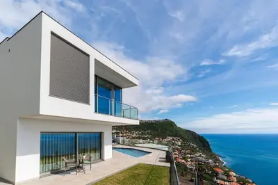 a house with a view of the ocean at Casa Joaquim by Rent2u, Lda in Arco da Calheta